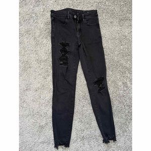 Distressed black skinny jeans